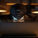 Concerned employer at a laptop discovering a salary spreadsheet was emailed to all staff in a data breach