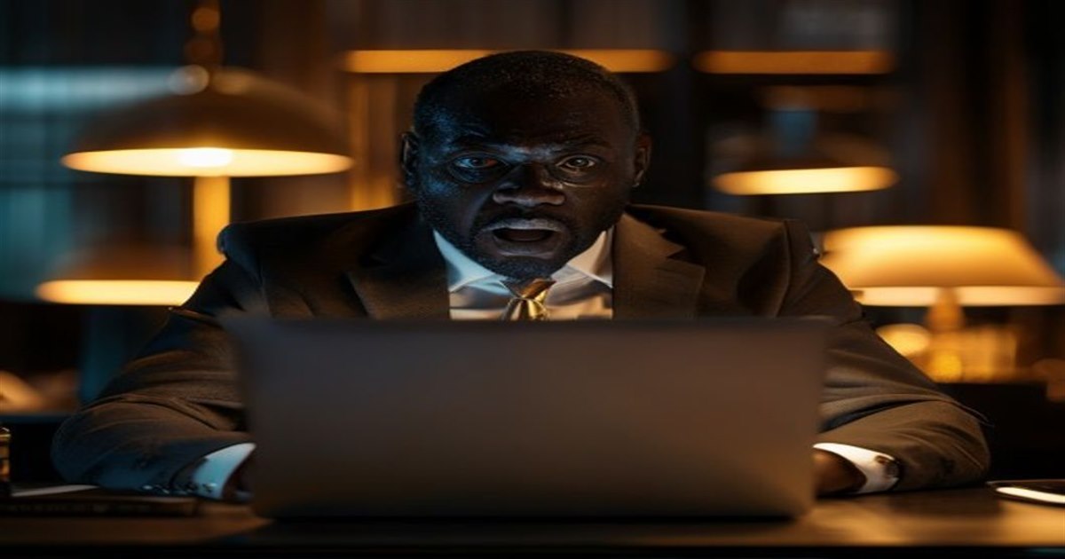 Concerned employer at a laptop discovering a salary spreadsheet was emailed to all staff in a data breach